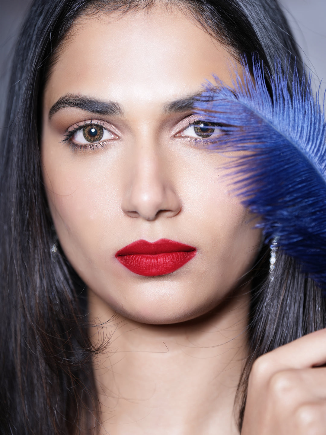Model wearing Evara liquid lipstick for a bold, flawless look.