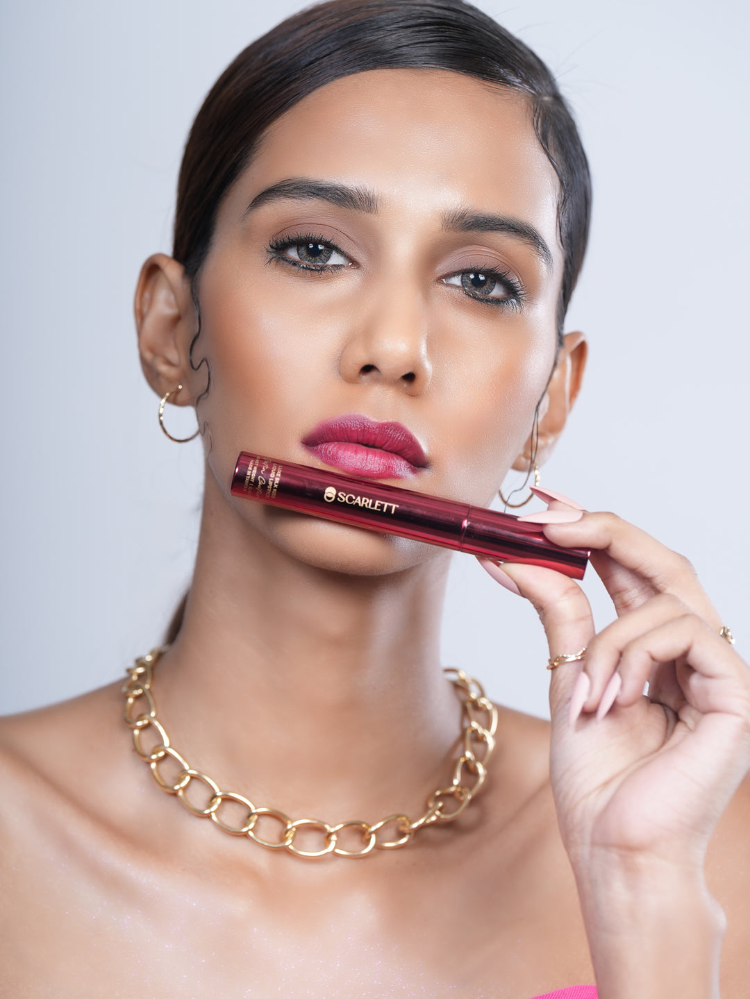 Model wearing Feodora liquid lipstick for a bold, flawless look.
